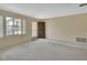 Bright living room with a large window and front door, offering ample natural light at 1320 Bakersfield Ave, Deltona, FL 32725