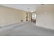 Spacious living room with neutral walls, and dining area with sliding doors at 1320 Bakersfield Ave, Deltona, FL 32725