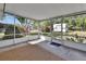 Enclosed back porch with screen and textured tan rug at 1320 Bakersfield Ave, Deltona, FL 32725
