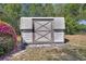 The storage shed features a secure door and durable construction, adding practicality to the property at 1320 Bakersfield Ave, Deltona, FL 32725