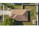 Aerial view of a home with a brown roof, spacious yard, and a long driveway at 1340 Babcock Ave, Deltona, FL 32725
