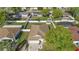 Aerial view of home with a fenced yard, shed, and mature trees at 1340 Babcock Ave, Deltona, FL 32725