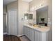 Bathroom vanity with double sinks, large mirror, and modern lighting at 1340 Babcock Ave, Deltona, FL 32725