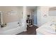 Bathroom with soaking tub, walk-in shower and double sink vanity at 1340 Babcock Ave, Deltona, FL 32725