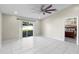 Bright bedroom featuring sliding glass doors to the backyard and neutral paint at 1340 Babcock Ave, Deltona, FL 32725