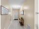 Bright foyer with tiled flooring, decorative console table, and a warm, inviting atmosphere at 1340 Babcock Ave, Deltona, FL 32725