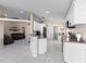 Open kitchen with white cabinetry, stainless steel appliances, and convenient breakfast bar seating at 1340 Babcock Ave, Deltona, FL 32725