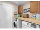 Bright laundry room featuring side-by-side washer and dryer at 1340 Babcock Ave, Deltona, FL 32725