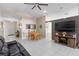 Spacious living room with tile flooring, ceiling fan and dining area, perfect for entertaining at 1340 Babcock Ave, Deltona, FL 32725