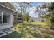 Lush backyard with mature trees and a shed, providing a serene outdoor space at 140 E Faith Ter, Maitland, FL 32751