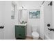 Updated bathroom with a green vanity, modern fixtures, and a shower with a white curtain at 140 E Faith Ter, Maitland, FL 32751