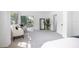 Bright bedroom with plush carpet, patio access, and sitting area for relaxation at 140 E Faith Ter, Maitland, FL 32751