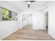 Bright bedroom with wood floors, a ceiling fan, and large windows for ample natural light at 140 E Faith Ter, Maitland, FL 32751