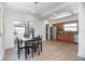 Open floor plan with dining area, kitchen, and backyard views at 140 E Faith Ter, Maitland, FL 32751