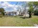 Charming exterior view of a single-story home with landscaped yard and mature trees at 140 E Faith Ter, Maitland, FL 32751