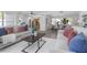 Open-concept living space with modern sofas, dining area, and kitchen in a bright and airy setting at 140 E Faith Ter, Maitland, FL 32751