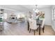 Open concept living space with wood floors, a fireplace, and lots of natural light at 140 E Faith Ter, Maitland, FL 32751