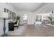 Bright office with a desk, chair, and artwork, seamlessly connected to the main living area at 140 E Faith Ter, Maitland, FL 32751