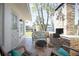 Relaxing patio featuring an outdoor brick fireplace and comfortable wicker seating at 140 E Faith Ter, Maitland, FL 32751