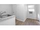 Bright room with a sink, AC unit and new floors and clean white walls at 140 E Faith Ter, Maitland, FL 32751