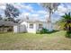 Exterior view of the shed featuring white siding, windows, and door at 140 E Faith Ter, Maitland, FL 32751