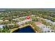 Aerial view of home in established neighborhood with pond and tree-lined streets at 1422 Carlow Cir, Ormond Beach, FL 32174