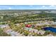 Aerial view of home in established neighborhood with pond and tree-lined streets at 1422 Carlow Cir, Ormond Beach, FL 32174