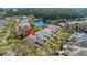 Beautiful aerial view of houses in a quiet neighborhood near a pond with mature trees at 1422 Carlow Cir, Ormond Beach, FL 32174