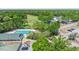 Aerial shows community pool, clubhouse, tennis courts, and golf course, providing recreational opportunities at 1422 Carlow Cir, Ormond Beach, FL 32174