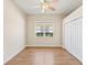 Comfortable bedroom with wood laminate flooring and a window that provides natural light at 1422 Carlow Cir, Ormond Beach, FL 32174