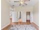 Spacious bedroom with walk-in closets, wood laminate flooring, and multiple doorways at 1422 Carlow Cir, Ormond Beach, FL 32174