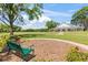 Beautiful clubhouse set against a lush green lawn, featuring a bench and landscaping for a welcoming atmosphere at 1422 Carlow Cir, Ormond Beach, FL 32174