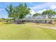 Exterior shot of the community clubhouse featuring a long porch and well-manicured lawns at 1422 Carlow Cir, Ormond Beach, FL 32174