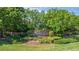 Entrance to Halifax Plantation with lush plants and shrubbery surrounding the brick community sign at 1422 Carlow Cir, Ormond Beach, FL 32174