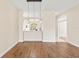 The dining area features wood laminate flooring and modern lighting, seamlessly connecting to the kitchen at 1422 Carlow Cir, Ormond Beach, FL 32174