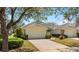 Charming single-story home featuring a two-car garage and well-manicured landscaping at 1422 Carlow Cir, Ormond Beach, FL 32174