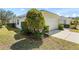 Charming single-story home featuring a well-manicured lawn and attached two-car garage at 1422 Carlow Cir, Ormond Beach, FL 32174