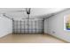 Spacious garage with epoxy flooring, offering ample parking and storage space at 1422 Carlow Cir, Ormond Beach, FL 32174