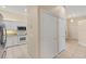 Bright kitchen featuring white cabinets, stainless steel appliances, and tile flooring for easy maintenance at 1422 Carlow Cir, Ormond Beach, FL 32174