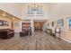 Elegant lobby area featuring comfortable seating, rich wood floors, and tasteful decor, creating a welcoming atmosphere at 1422 Carlow Cir, Ormond Beach, FL 32174