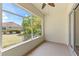 Screened patio with a view of the garden and neighborhood, providing an inviting outdoor living space at 1422 Carlow Cir, Ormond Beach, FL 32174