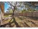 A sprawling yard featuring a wooden fence and large shade trees with Spanish moss at 1430 17Th St, Orange City, FL 32763