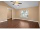 Spacious bedroom boasts laminate flooring, ceiling fan, and bright natural light at 1430 17Th St, Orange City, FL 32763
