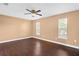 Bright bedroom with a ceiling fan, sleek floors, and windows, creating a comfortable and inviting space at 1430 17Th St, Orange City, FL 32763