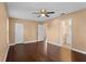 Bedroom features wood flooring, a ceiling fan, closet, and ensuite bath creating a comfortable retreat at 1430 17Th St, Orange City, FL 32763