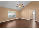 Bedroom with laminate flooring, a ceiling fan, and natural light at 1430 17Th St, Orange City, FL 32763