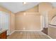 Open dining area with tile floors, vaulted ceiling, and lots of natural light at 1430 17Th St, Orange City, FL 32763