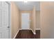 The house has a large entryway with a white front door and hardwood floors at 1430 17Th St, Orange City, FL 32763