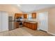 Cozy kitchen featuring stainless steel appliances, updated cabinetry, and tile flooring at 1430 17Th St, Orange City, FL 32763