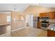Open kitchen boasts stainless steel appliances, tile floors, and an open layout at 1430 17Th St, Orange City, FL 32763